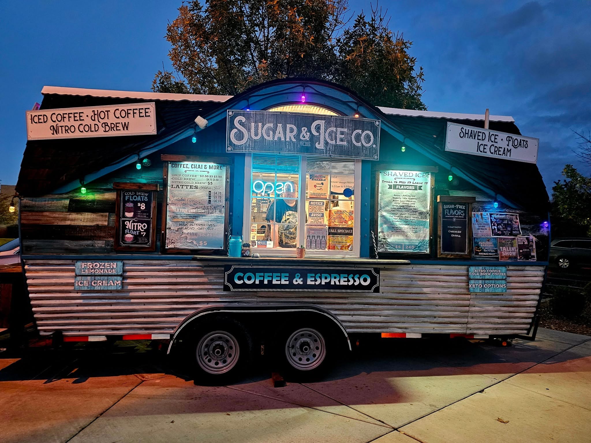 Sugar & Ice truck lit up for an evening event